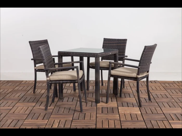 Elegant wicker dining set with table and matching outdoor chairs